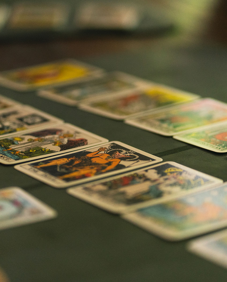 Professional tarot reading service in Ubud Bali with cards spread on mystical table in Ayutyas Holistic Healing Home Sukawati